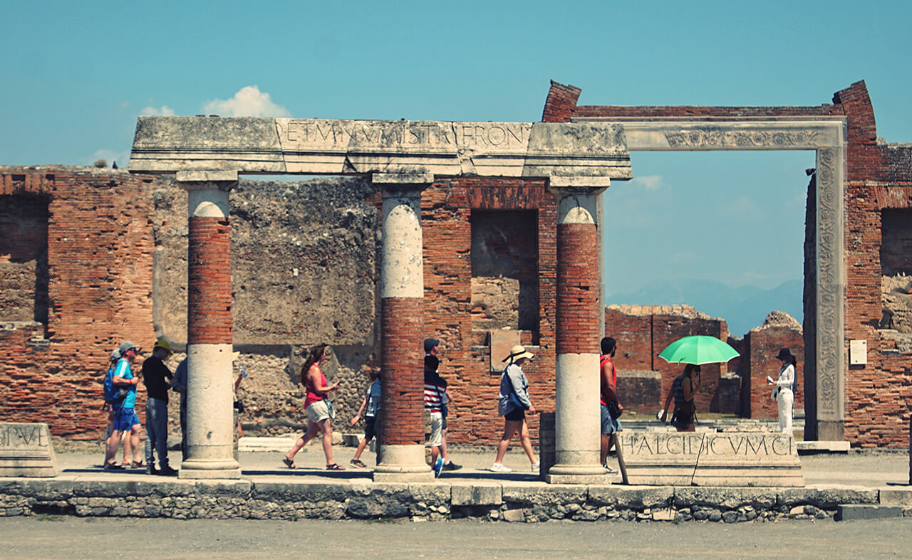 Visitors at Pompeii columns
